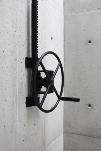 A blacksmith crafted the crank (below) used to open a window in Casa 2G (above) by S–AR. Photographs courtesy of the architects.